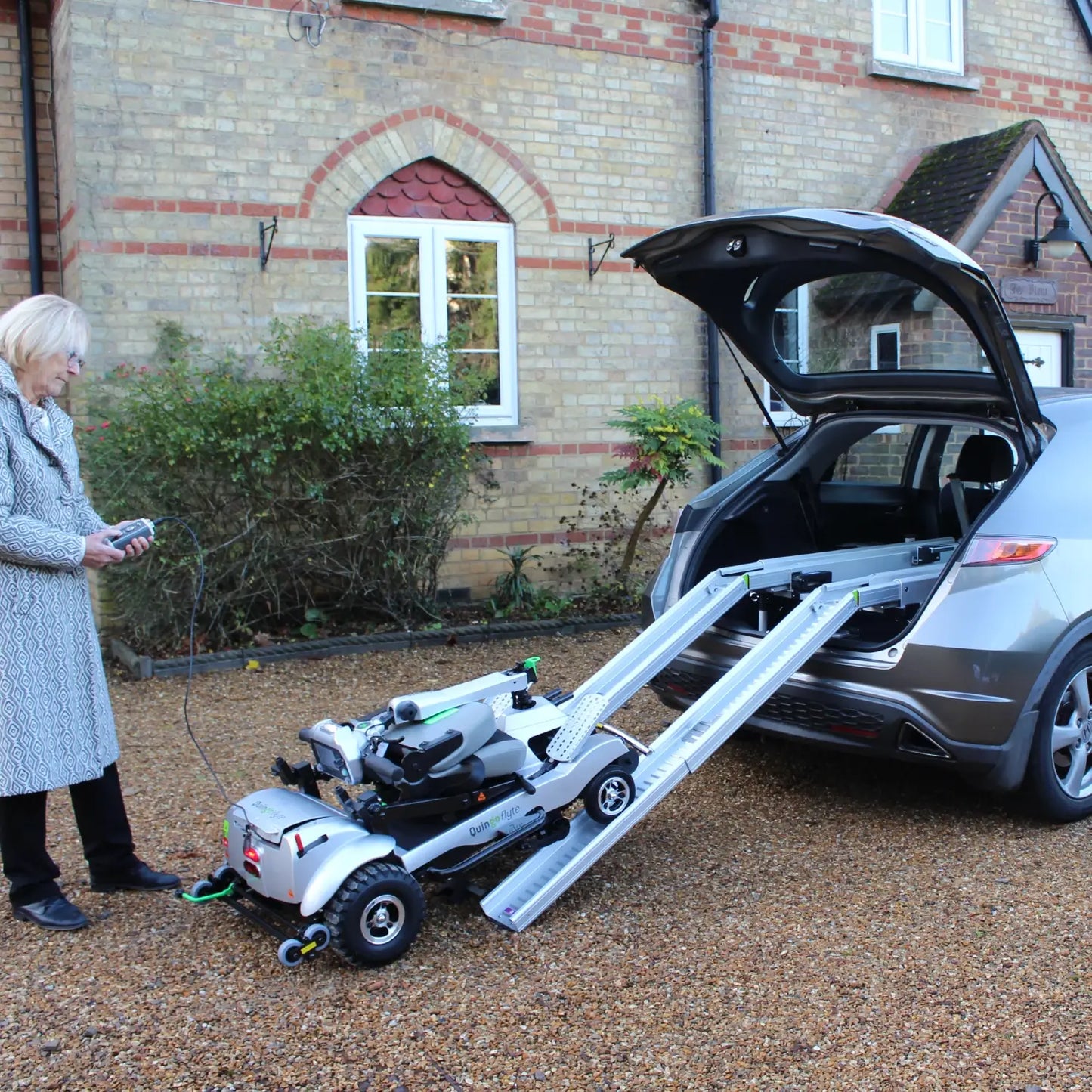 Comfy Go Quingo Flyte Mobility Scooter with MK2 Docking Station